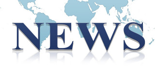 News-Schrift vor Weltkarte